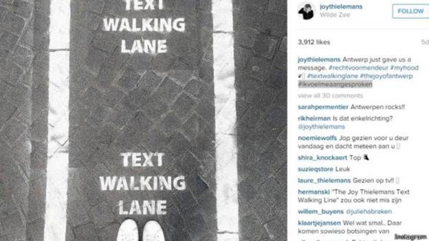 Cidade belga ganha faixa pra quem anda mexendo no celular (2)